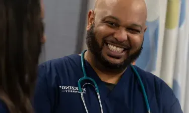 Male Paramedic to BSN Student Smiling in Nashville Nursing Simulation Lab